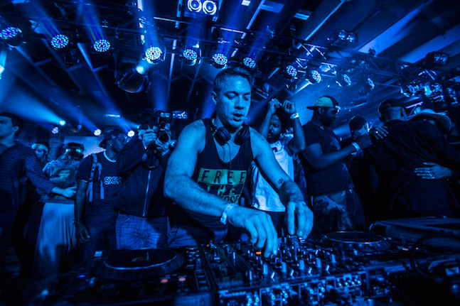 Close up of Diplo performing a DJ set