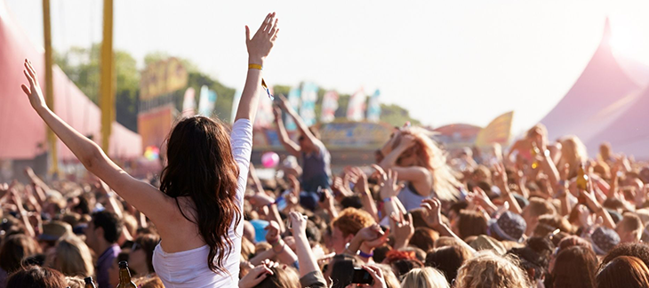 People at an outdoor music festival