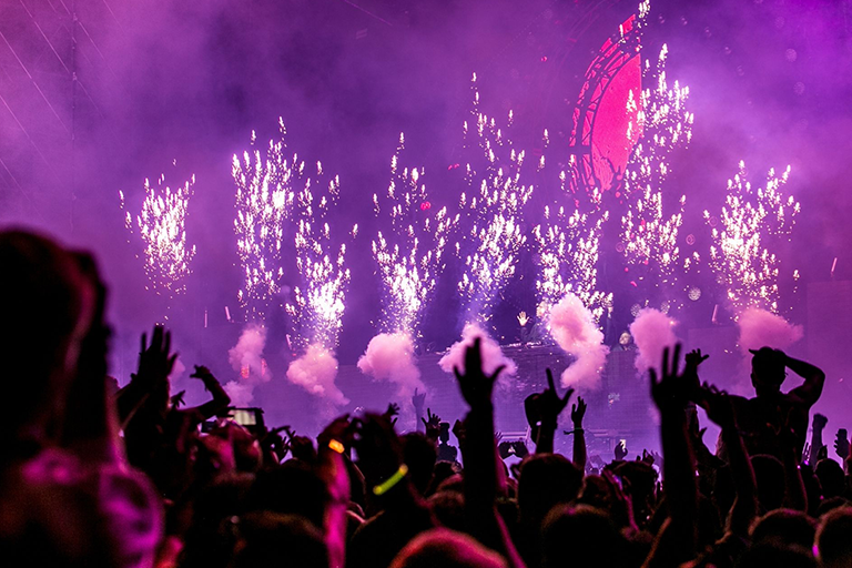 A crowd watching fireworks 