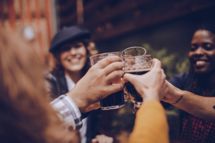 Friends clink glasses at happy hour in Las Vegas