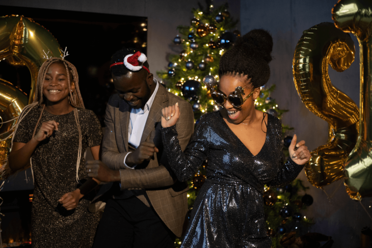 People dancing to Christmas EDM songs at a party