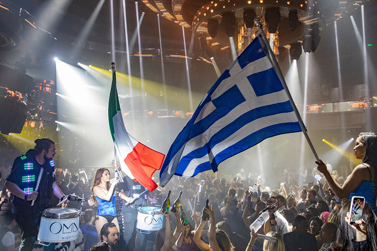 People waving various flags at the Omnia nightclub in Las Vegas 