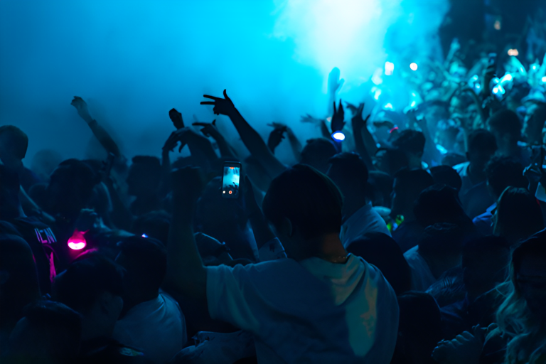 a nightclub lit up in blue light and smoke 