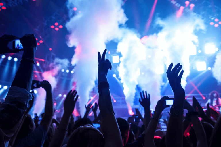 a nightclub filled with dancing people 