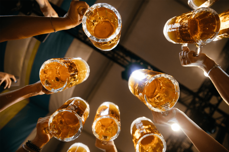 Beer glasses being raised