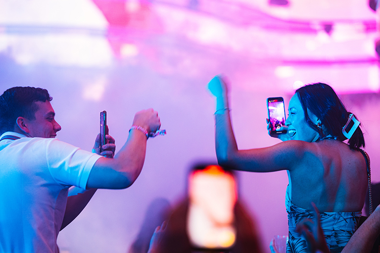 People partying at an illuminated nightclub in Las Vegas