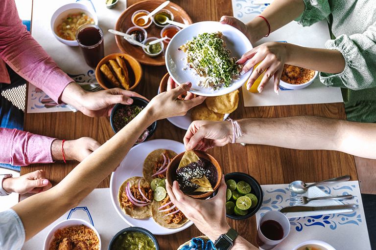 A group of friends eating tacos