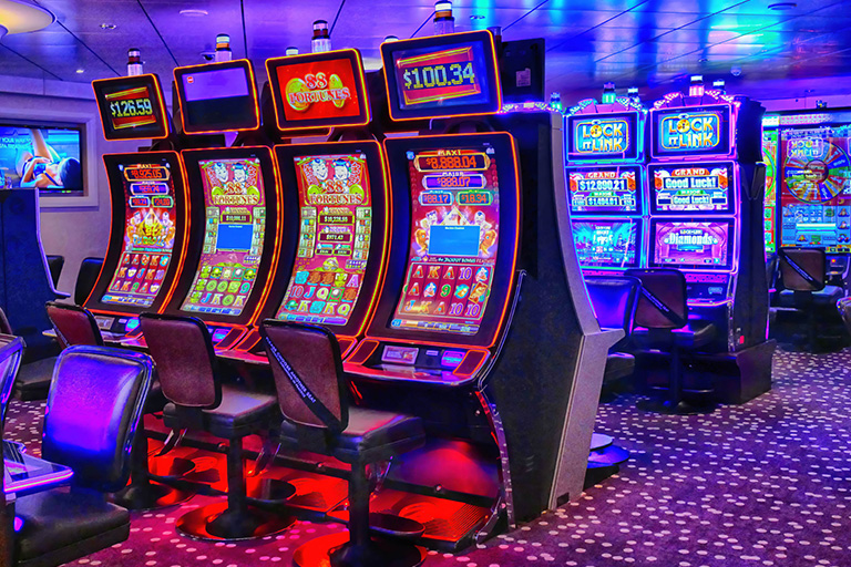Several rows of slot machines in a casino
